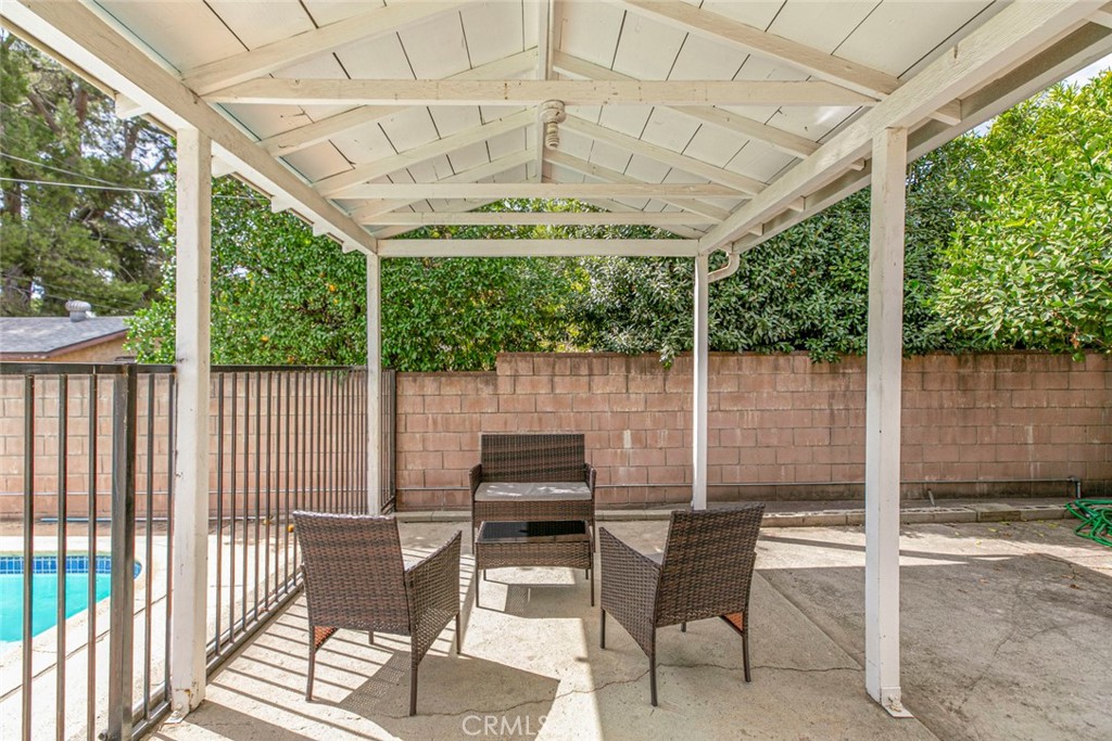 13166 Aztec Street Sylmar, CA 91342 - Photo 31 of 48 a patio with yard glass top table and chairs