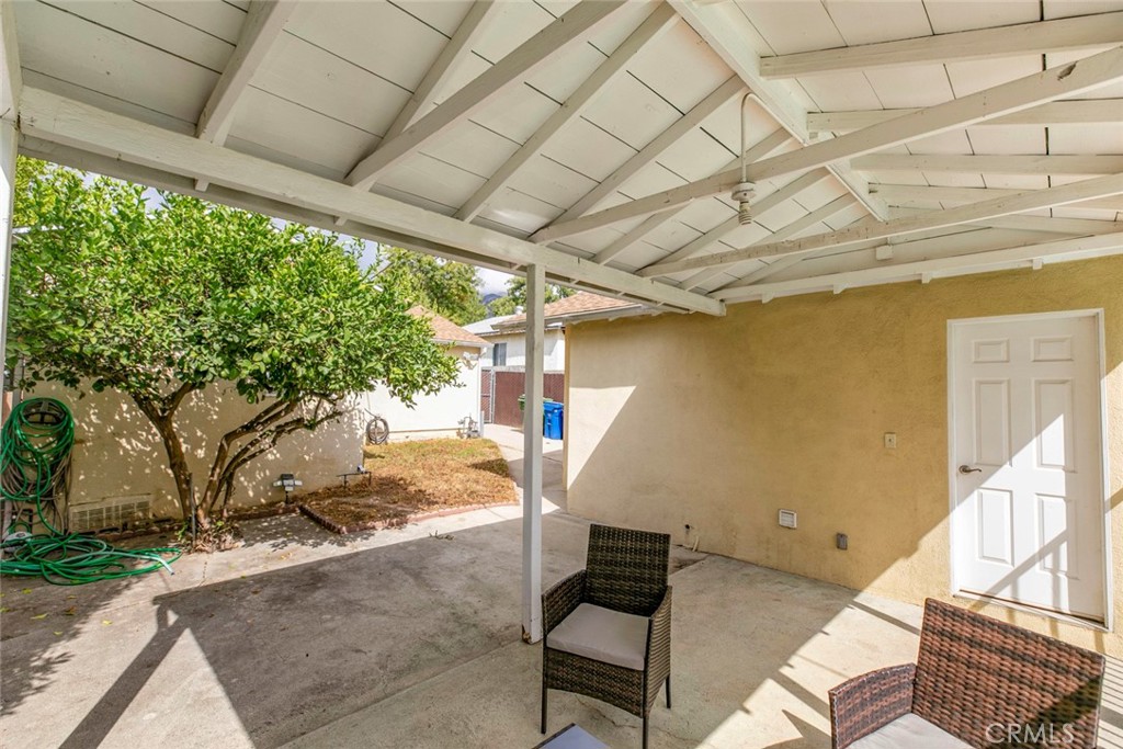13166 Aztec Street Sylmar, CA 91342 - Photo 32 of 48 a backyard of a house with seating space