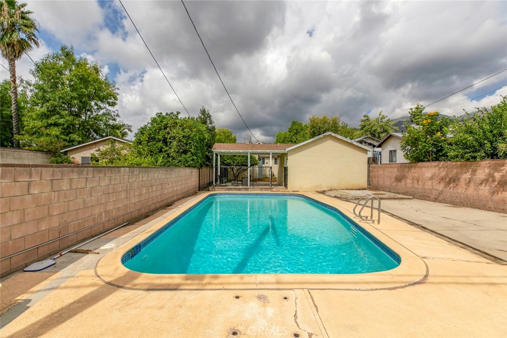 13166 Aztec Street Sylmar, CA 91342 - Photo 39 of 48 a view of a swimming pool with a yard