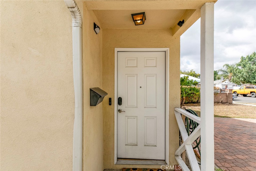 13166 Aztec Street Sylmar, CA 91342 - Photo 4 of 48 a view of a hallway with wooden floor and staircase