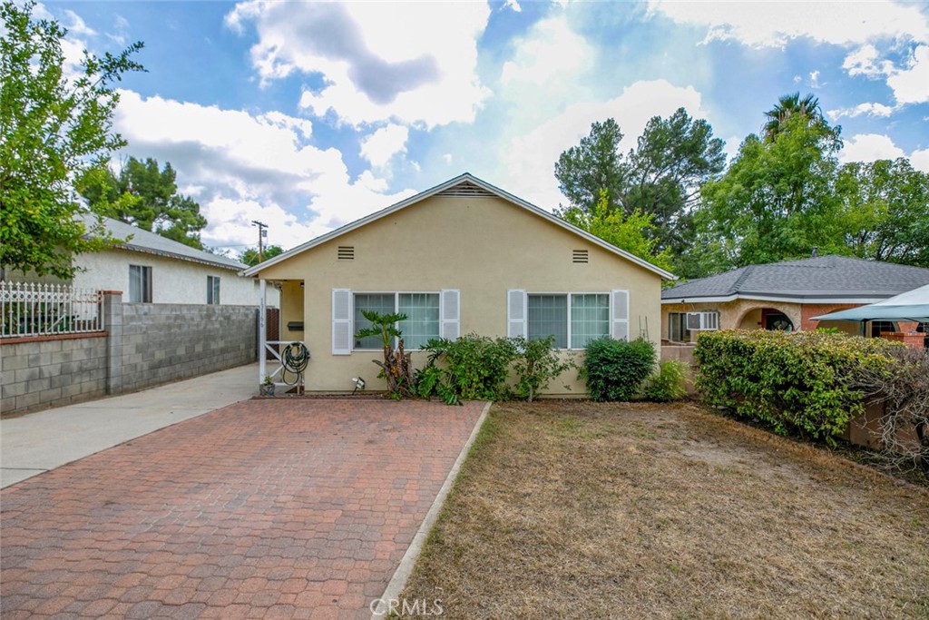 13166 Aztec Street Sylmar, CA 91342 - Photo 42 of 48 a front view of house with yard and trees around