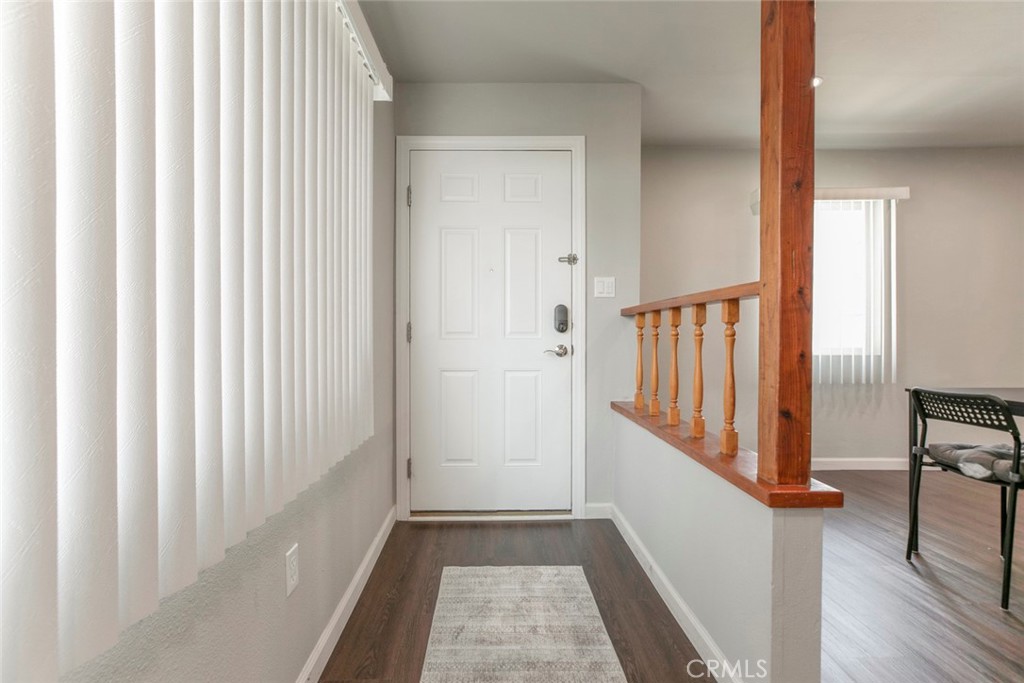 13166 Aztec Street Sylmar, CA 91342 - Photo 6 of 48 a view of a hallway with wooden floor and staircase