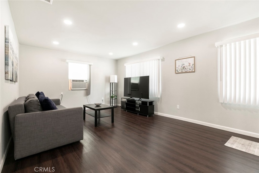 13166 Aztec Street Sylmar, CA 91342 - Photo 9 of 48 a living room with furniture and a flat screen tv