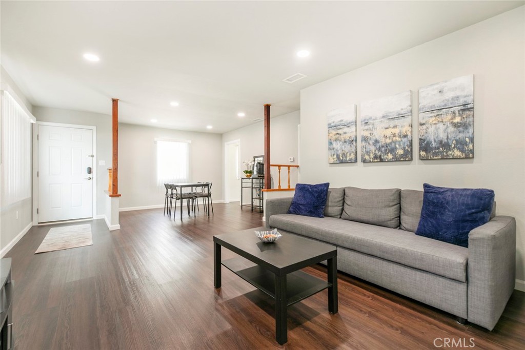 13166 Aztec Street Sylmar, CA 91342 - Photo 10 of 48 a living room with furniture and wooden floor