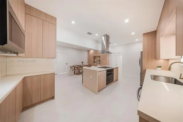 a kitchen with a refrigerator and a cabinets