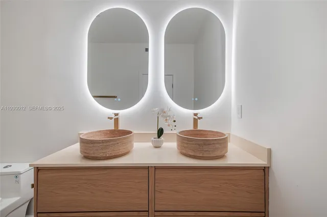 a bathroom with a toilet and shower