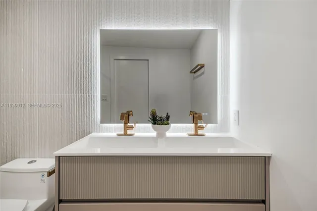 a view of a backyard with couches and plants