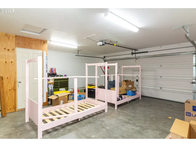 a bedroom with furniture and gym equipment