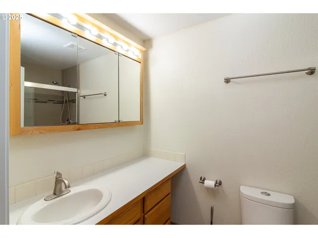 a bathroom with a sink and mirror