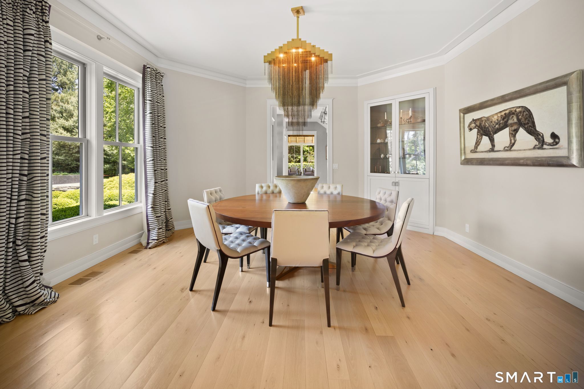 5 West Branch Road Weston, CT 06883 - Photo 18 of 40 a dining room with furniture a chandelier and wooden floor