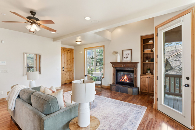 3026 Lower Saddleback Road Park City, UT 84098 - Photo 6 of 71 Living room featuring ceiling fan, a tiled fireplace, wood finished floors, and recessed lighting