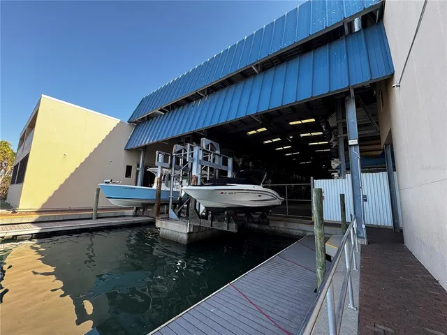 a view of house with swimming pool and sitting area