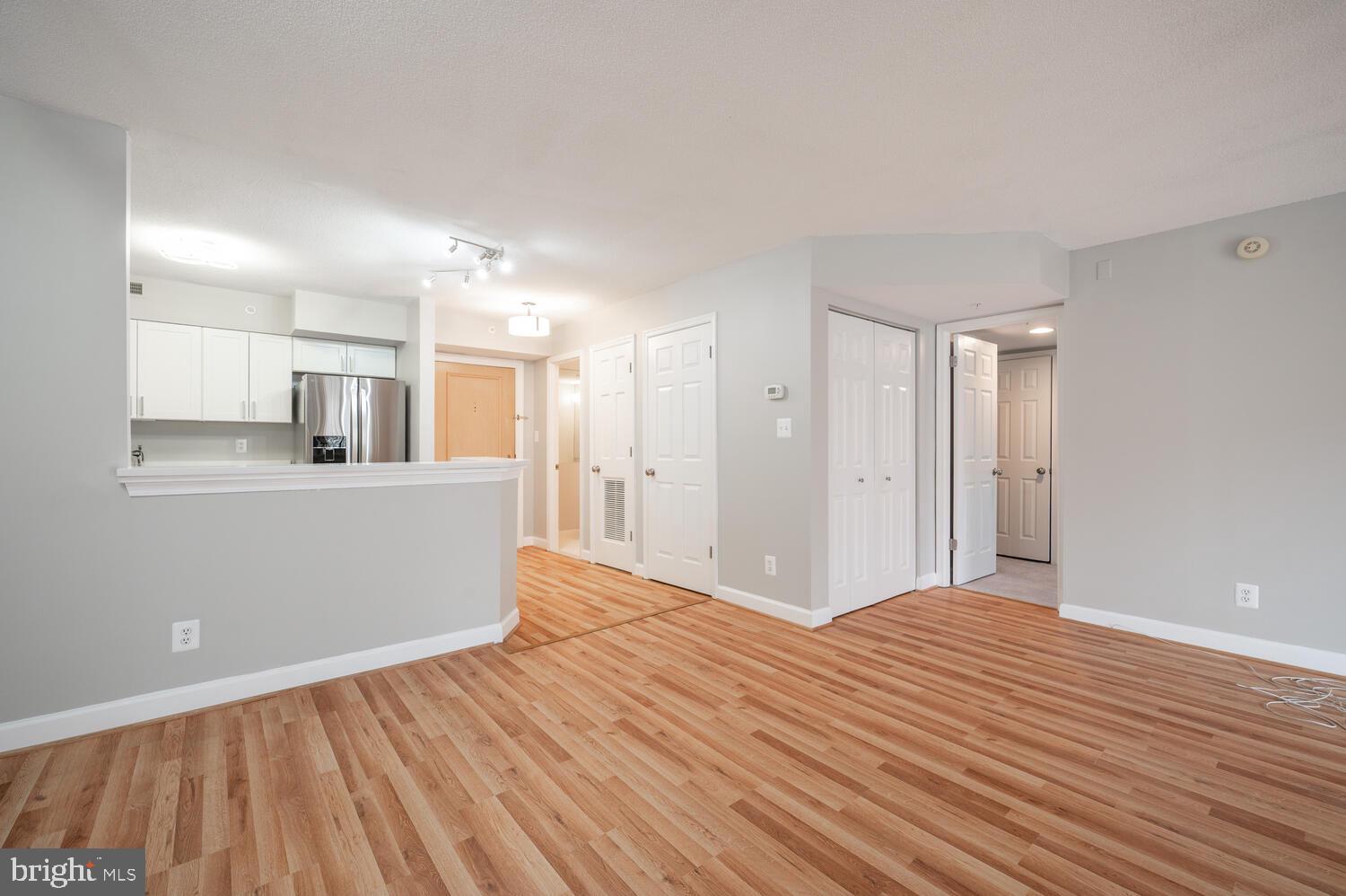 5000 Battery Lane, Unit 207 Bethesda, MD 20814 - Photo 11 of 34 a view of a kitchen with wooden floor and a kitchen