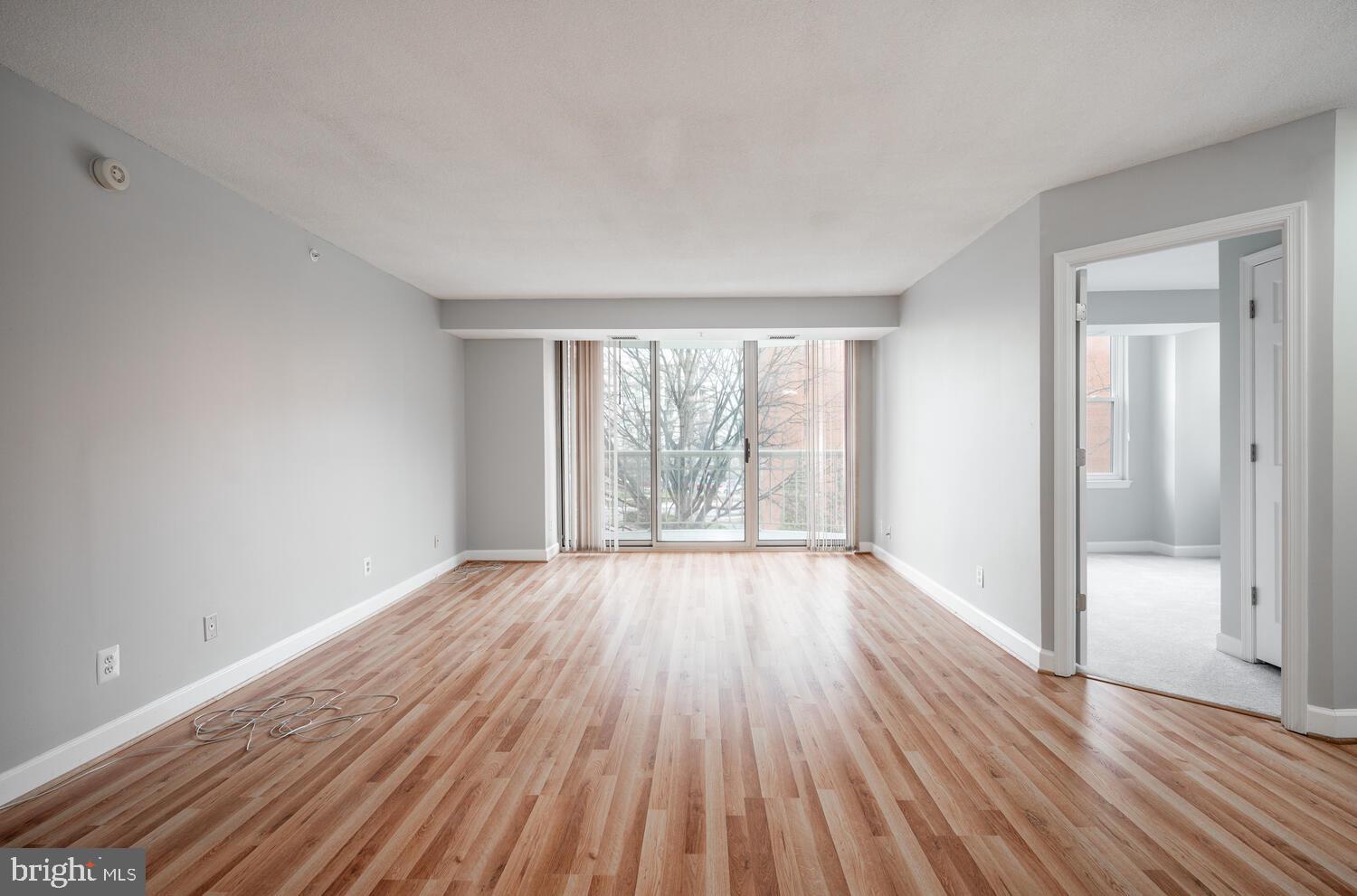 5000 Battery Lane, Unit 207 Bethesda, MD 20814 - Photo 14 of 34 wooden floor in an empty room with a window
