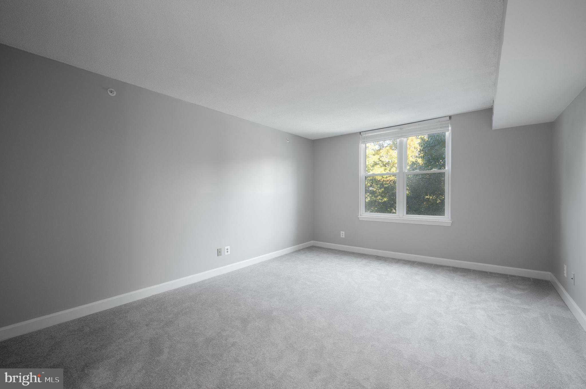 5000 Battery Lane, Unit 207 Bethesda, MD 20814 - Photo 19 of 34 an empty room with windows