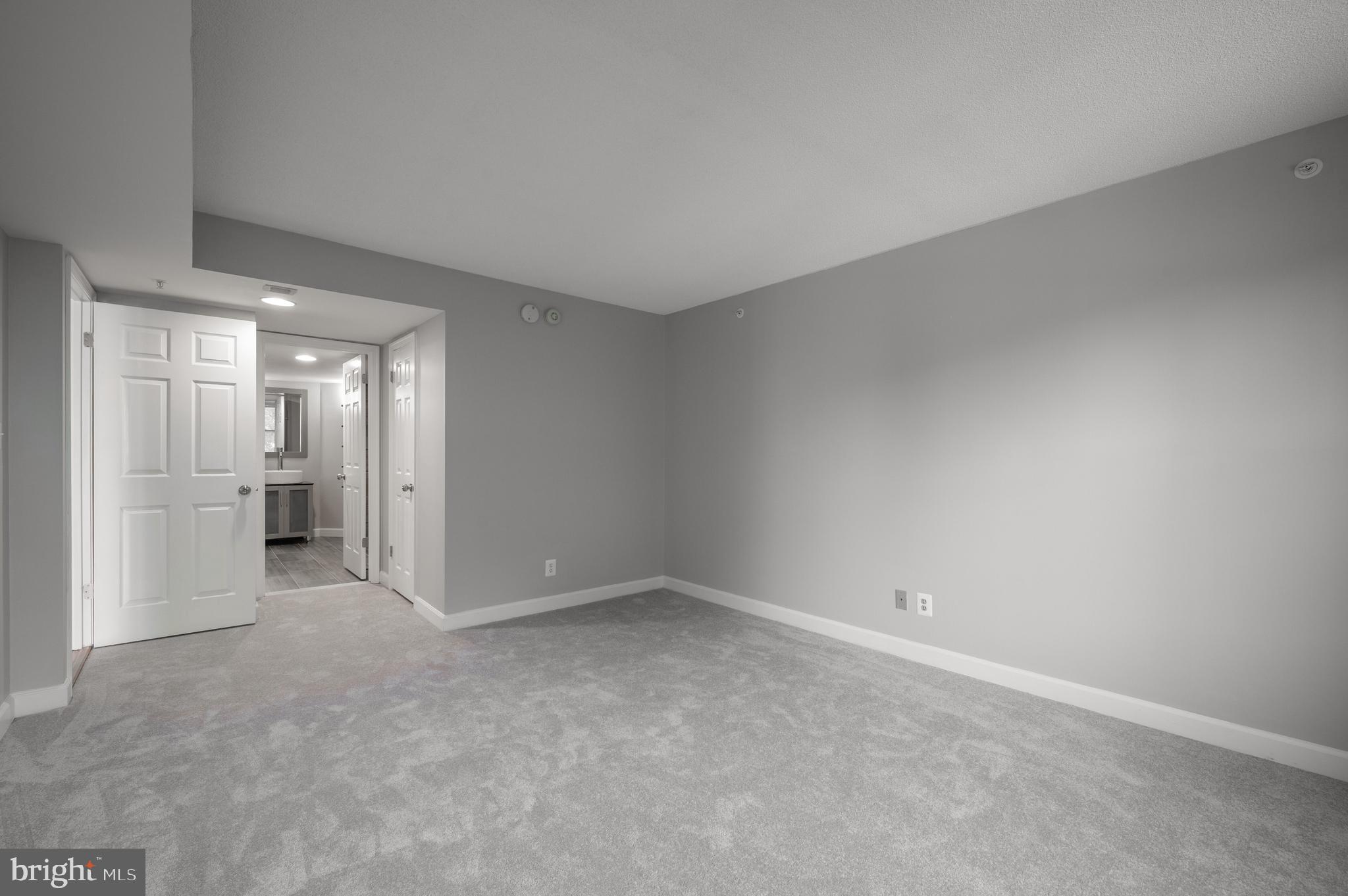 5000 Battery Lane, Unit 207 Bethesda, MD 20814 - Photo 20 of 34 an empty room with an entrance to other room