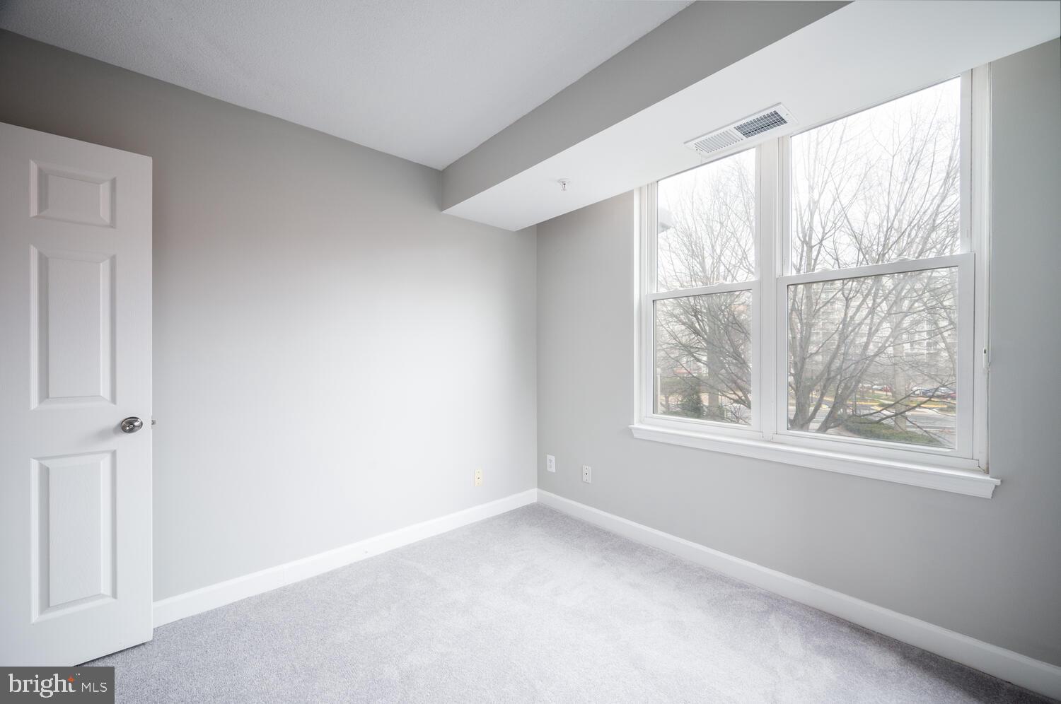5000 Battery Lane, Unit 207 Bethesda, MD 20814 - Photo 23 of 34 an empty room with windows