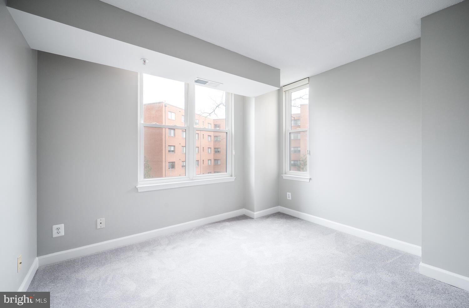 5000 Battery Lane, Unit 207 Bethesda, MD 20814 - Photo 24 of 34 a view of an empty room with a window