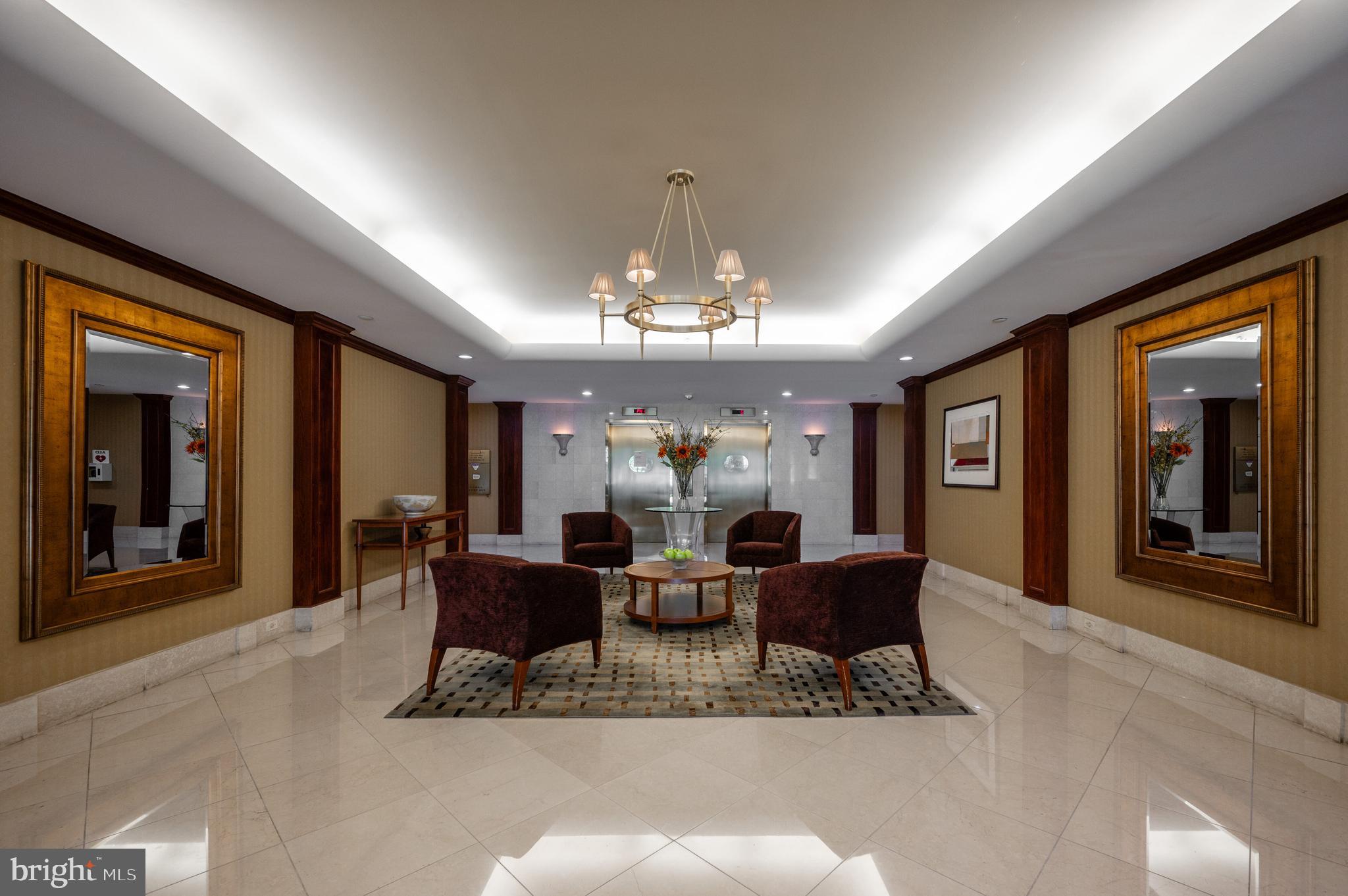 5000 Battery Lane, Unit 207 Bethesda, MD 20814 - Photo 26 of 34 a view of a dining room with furniture chandelier and a large window