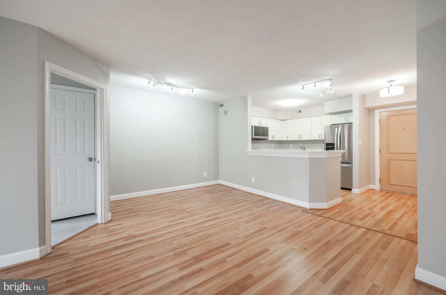 5000 Battery Lane, Unit 207 Bethesda, MD 20814 - Photo 3 of 34 a view of a kitchen with wooden floor