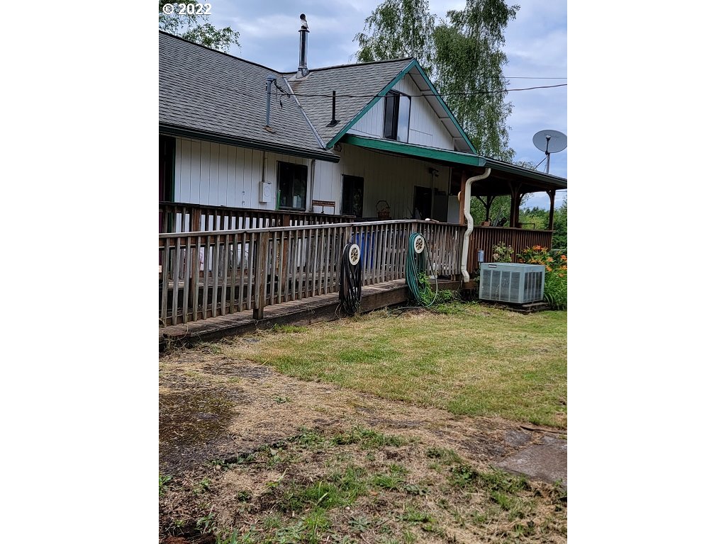 26817 Northeast Hathaway Road Camas, WA 98607 - Photo 2 of 25 a view of a house with wooden fence