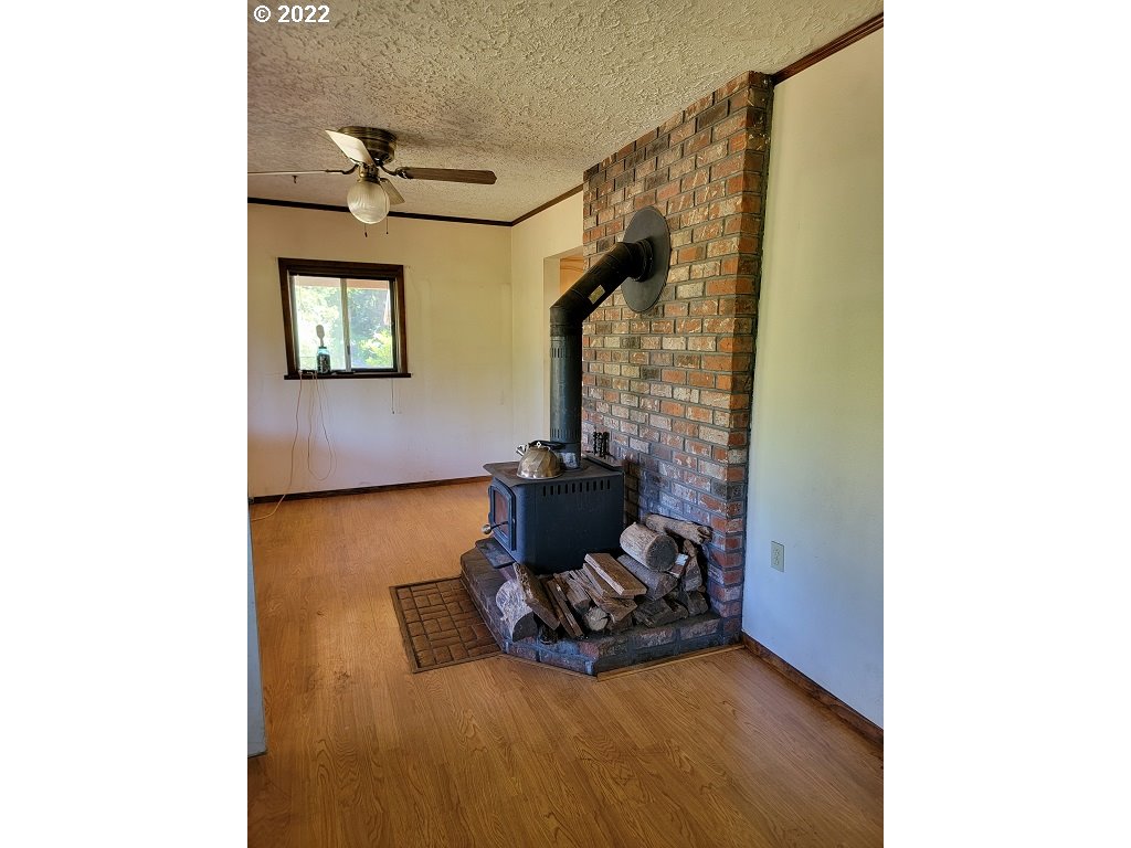 26817 Northeast Hathaway Road Camas, WA 98607 - Photo 22 of 25 a living room with furniture and a fireplace