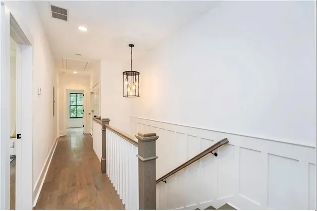 a view of a hallway with a white walls
