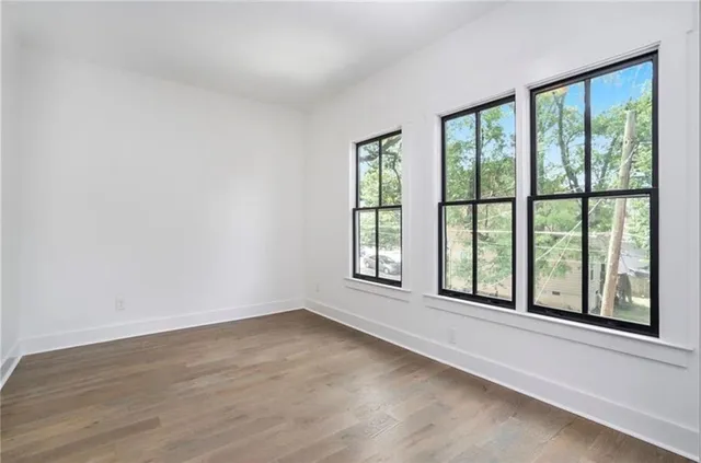 a view of an empty room with a window