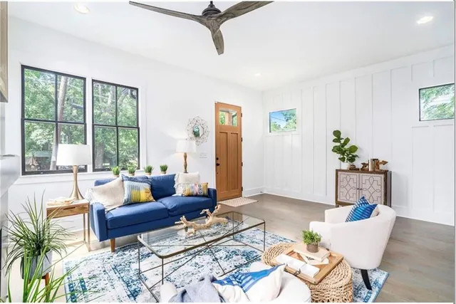 a living room with furniture and a window