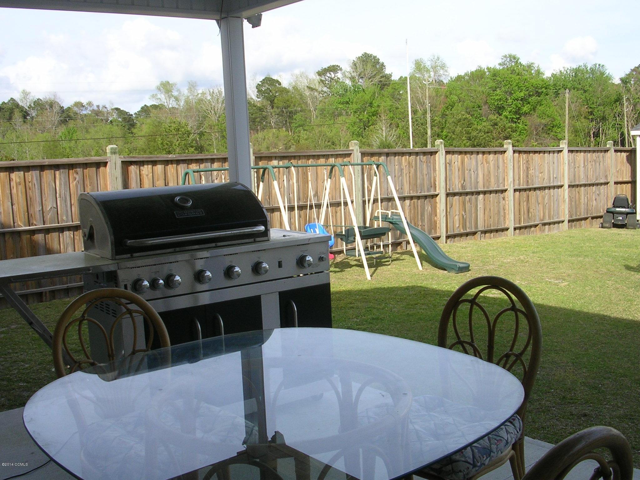 465 Nine Foot Road Newport, NC 28570 - Photo 28 of 33 back covered porch to 8' fence