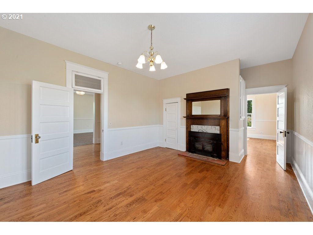 36902 South Kropf Road Woodburn, OR 97071 - Photo 11 of 26 a view of an empty room with wooden floor and a window