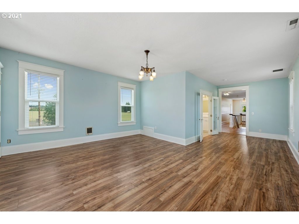 36902 South Kropf Road Woodburn, OR 97071 - Photo 15 of 26 a view of empty room with wooden floor and fan