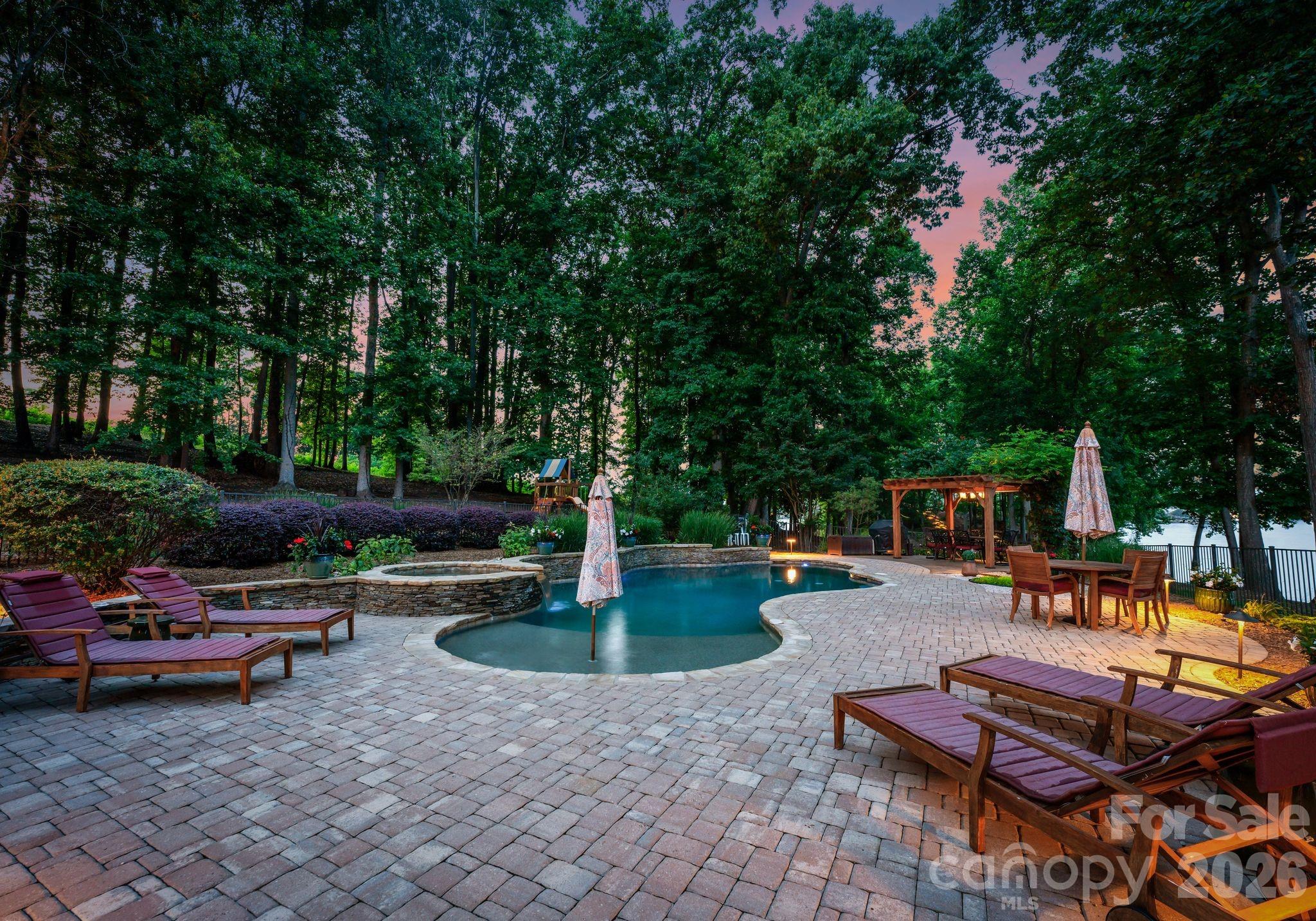 9184 Greenwood Road Terrell, NC 28682 - Photo 20 of 48 a swimming pool with outdoor seating water slide and fire pit