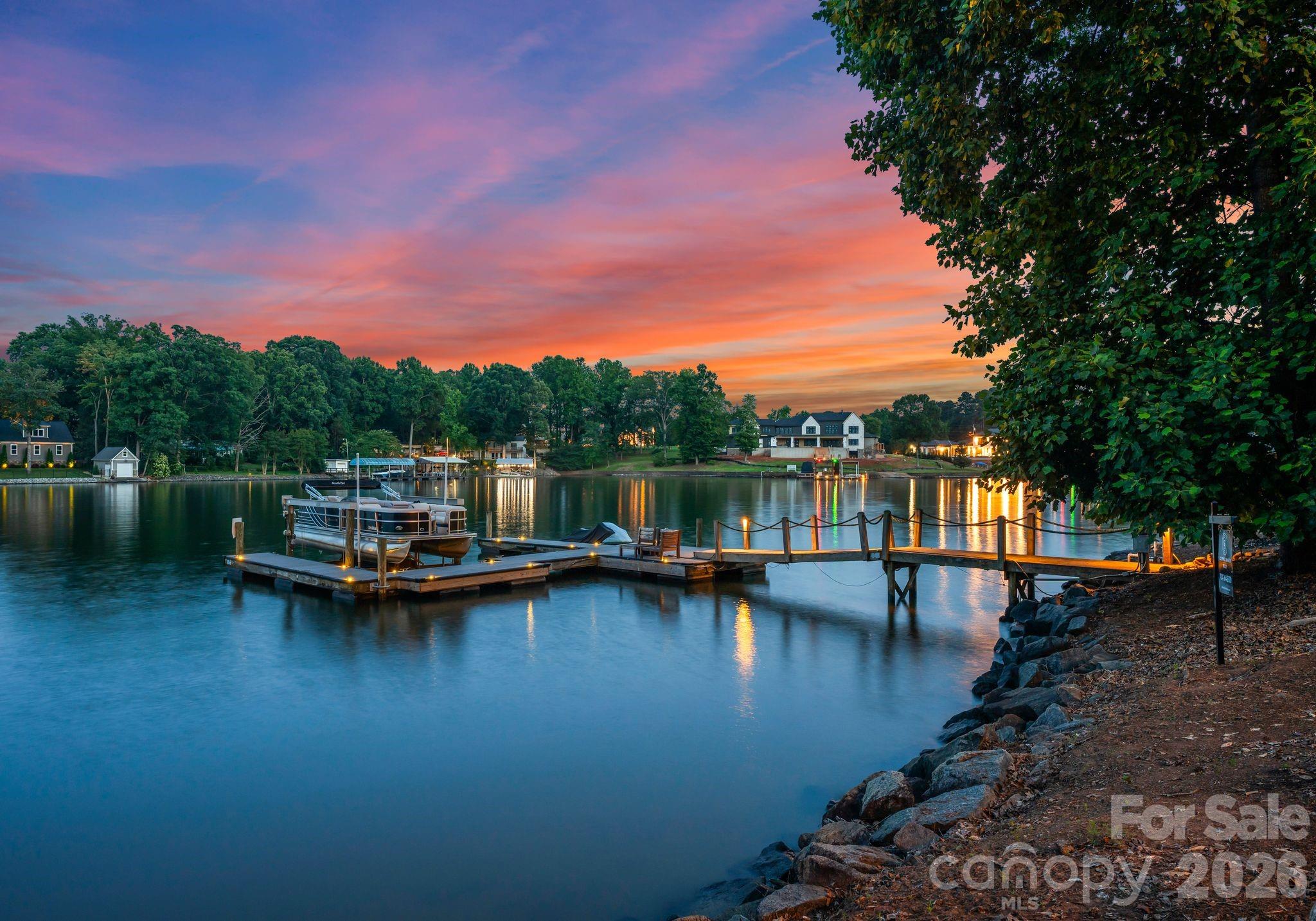 9184 Greenwood Road Terrell, NC 28682 - Photo 21 of 48 a view of a lake with boats and trees in the background