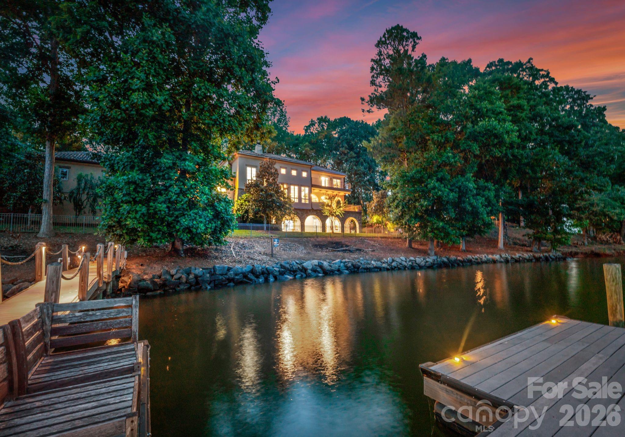9184 Greenwood Road Terrell, NC 28682 - Photo 24 of 48 a view of a lake with boats and trees in the background
