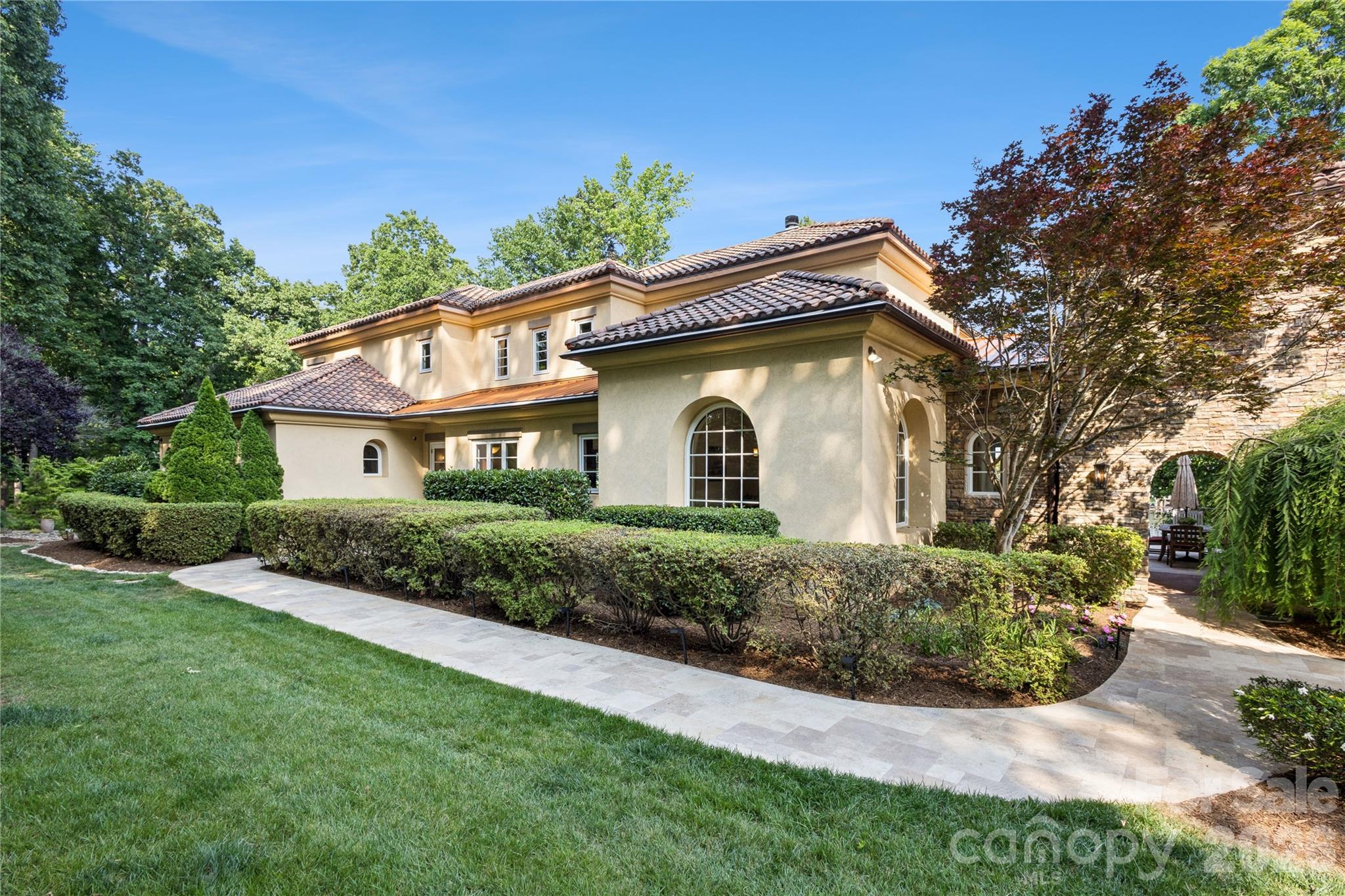9184 Greenwood Road Terrell, NC 28682 - Photo 26 of 48 a front view of a house with a garden and plants