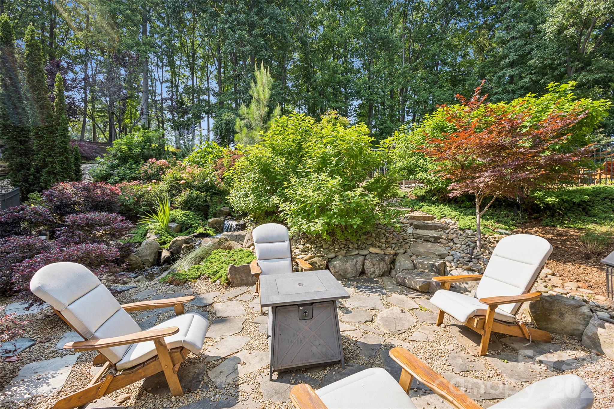 9184 Greenwood Road Terrell, NC 28682 - Photo 29 of 48 a view of a chairs and table in backyard