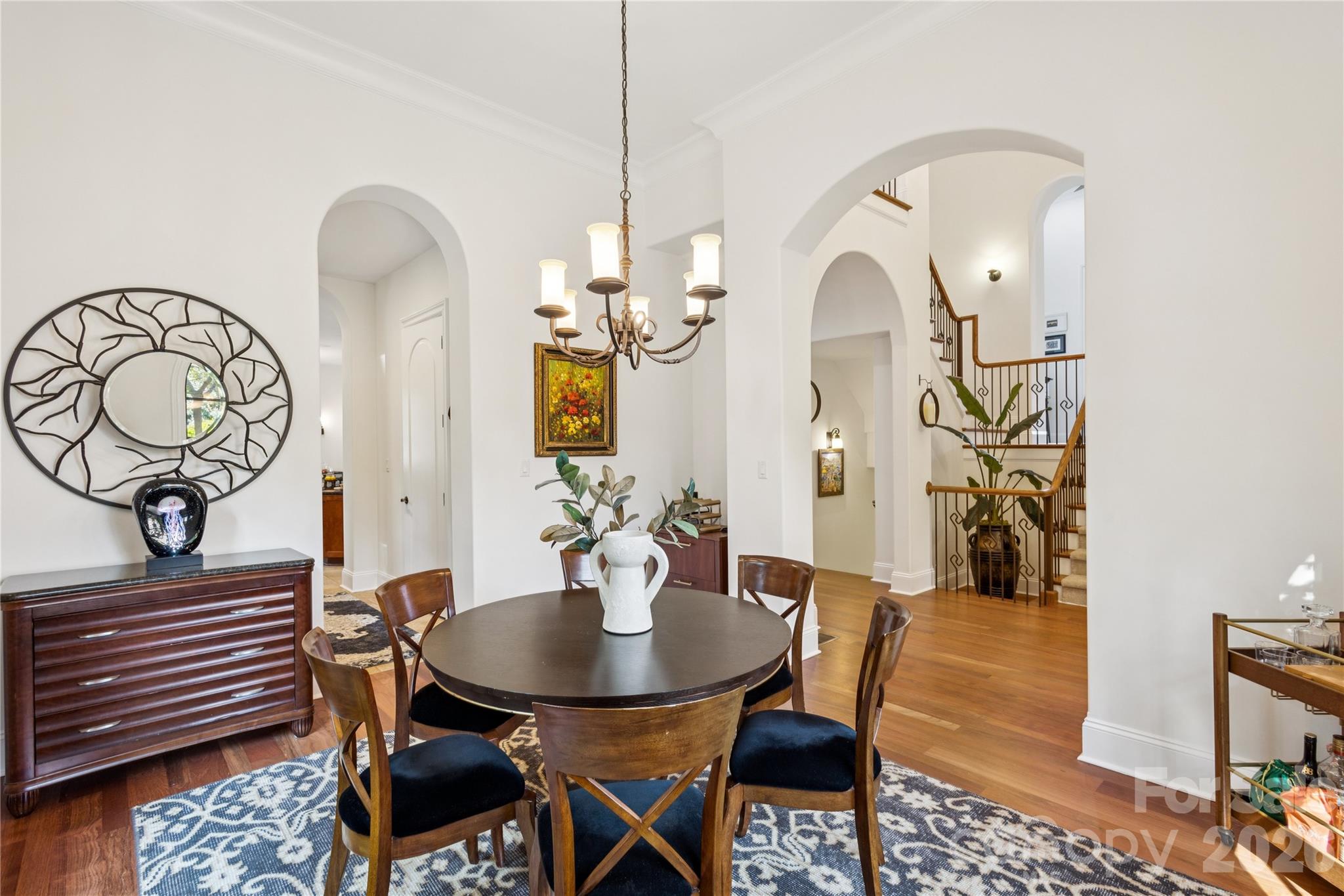 9184 Greenwood Road Terrell, NC 28682 - Photo 36 of 48 a view of a dining room with furniture and a chandelier
