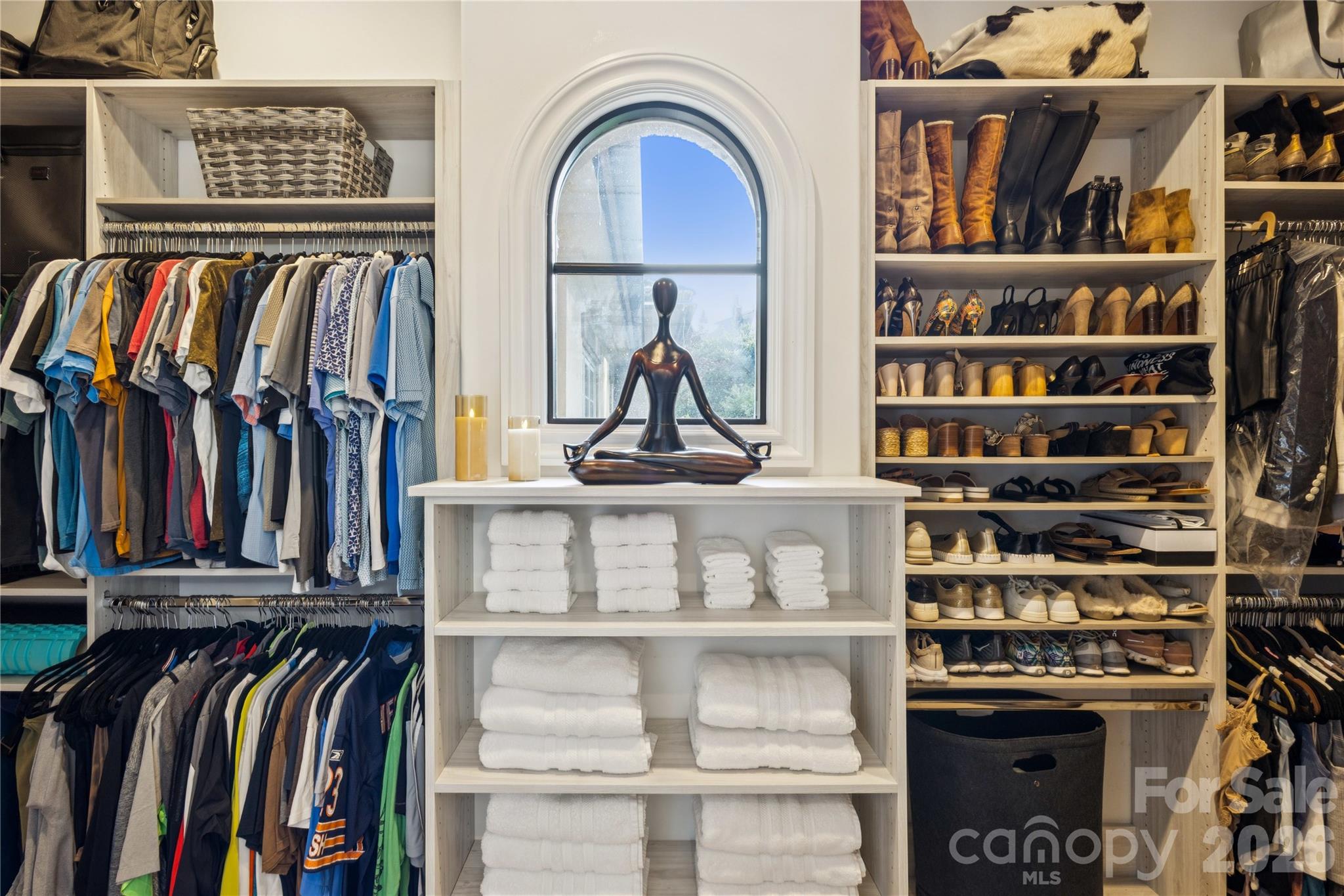 9184 Greenwood Road Terrell, NC 28682 - Photo 39 of 48 a view of walk in closet with clothes and shoes