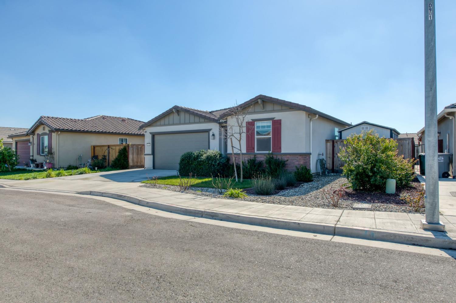 3606 Morro Rock Place Madera, CA 93637 - Photo 2 of 46 front view of a house with a small yard