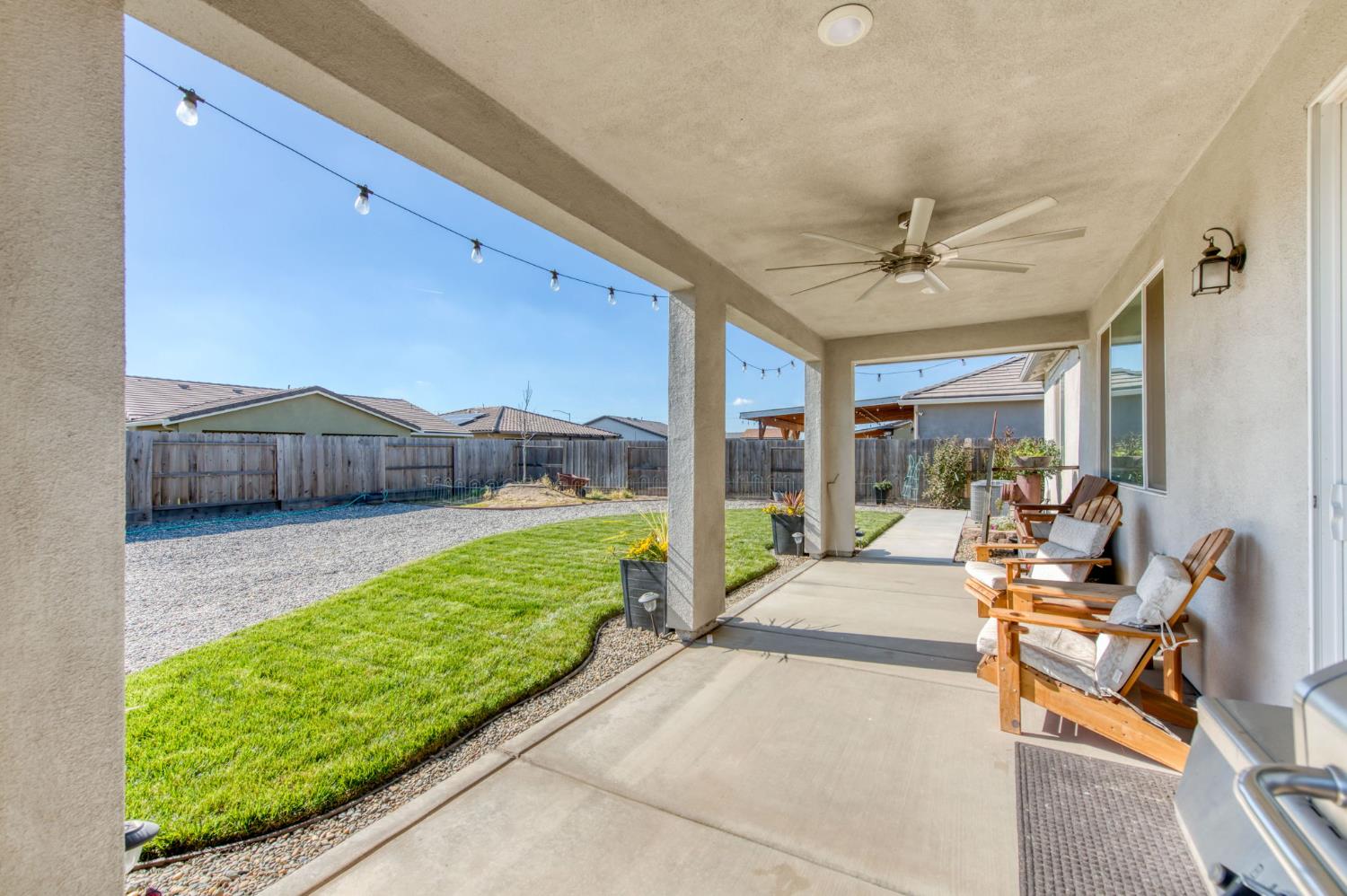 3606 Morro Rock Place Madera, CA 93637 - Photo 38 of 46 a living room with a patio