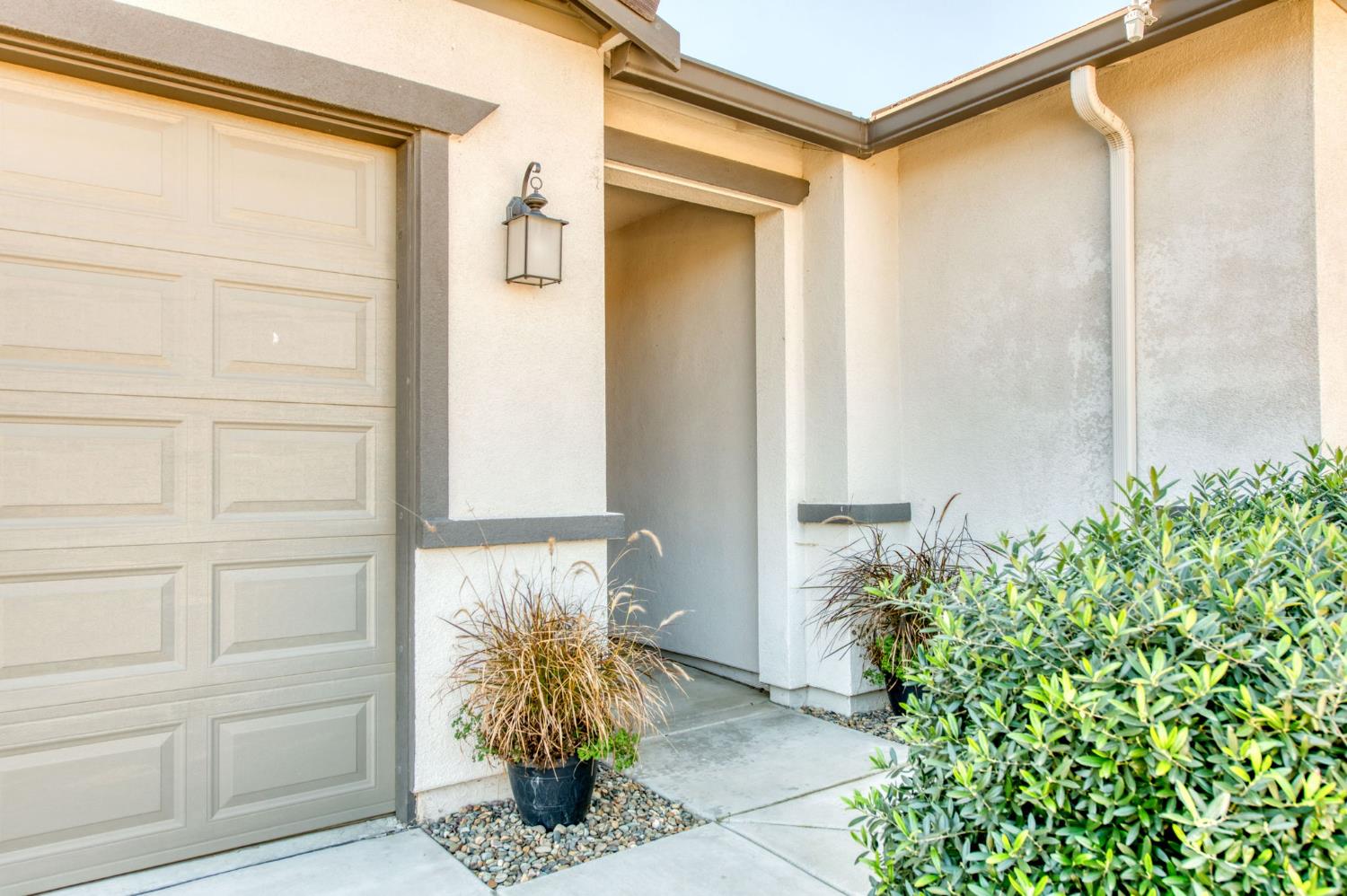 3606 Morro Rock Place Madera, CA 93637 - Photo 6 of 46 a front view of a house with a yard