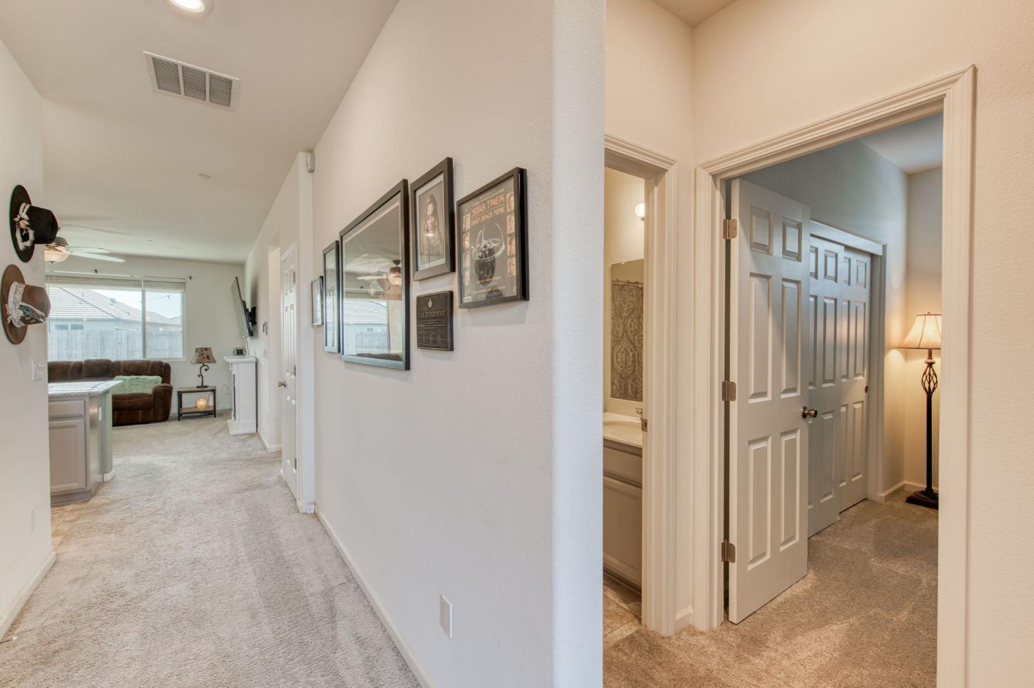 3606 Morro Rock Place Madera, CA 93637 - Photo 9 of 46 a view of hallway with livingroom and furniture