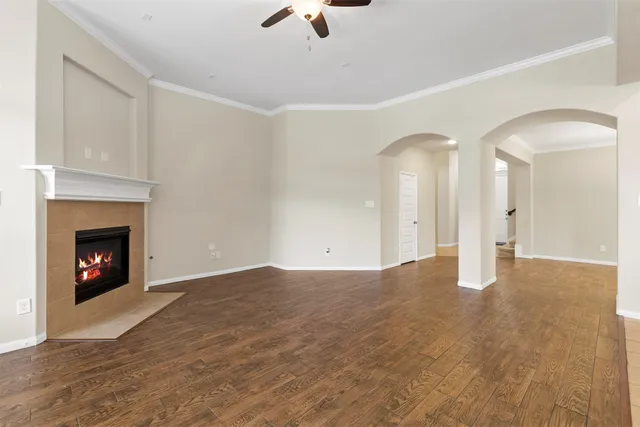 a view of an empty room with a fireplace