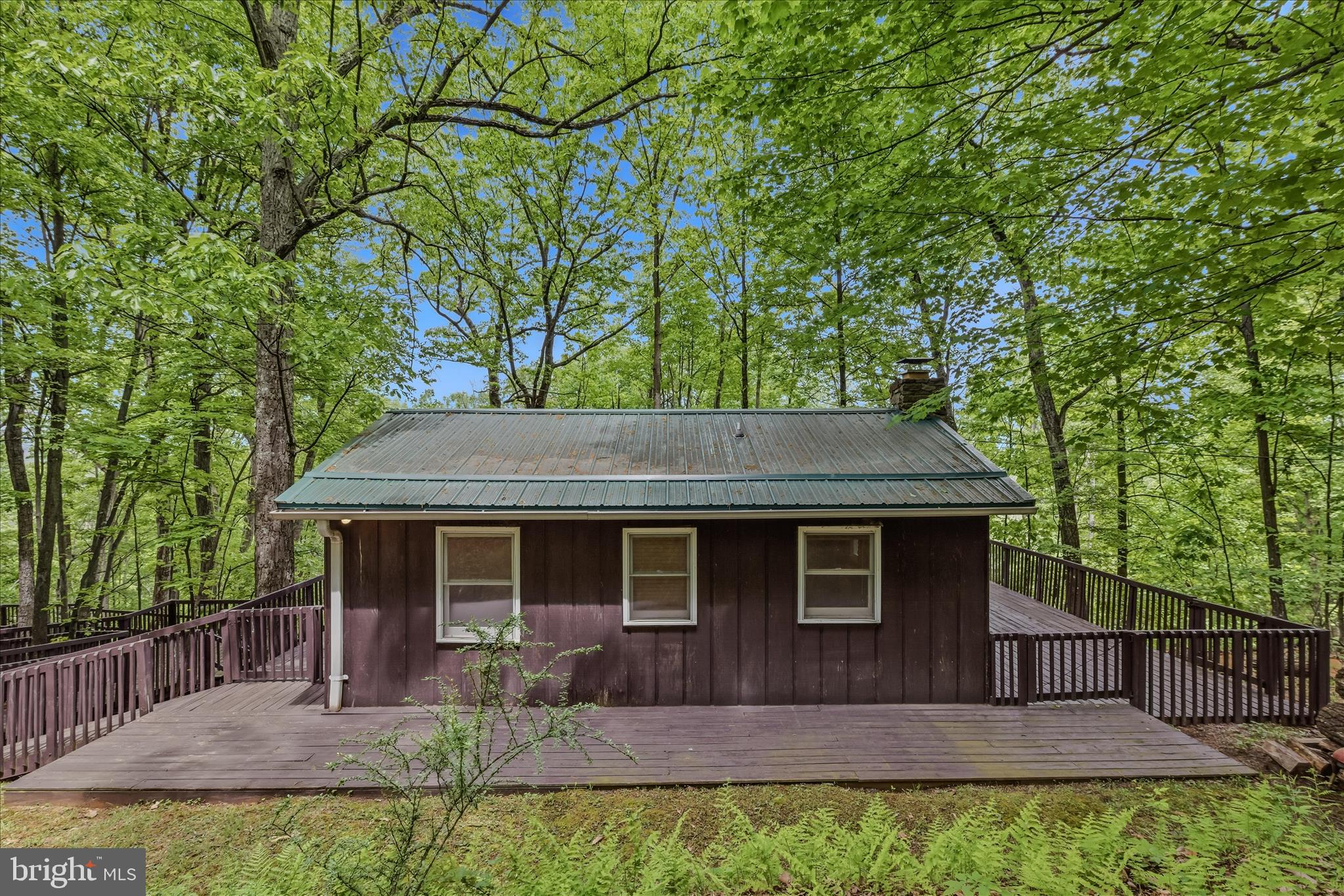 98 Ore Trail Berkeley Springs, WV 25411 - Photo 5 of 46 a backyard of a house with seating space