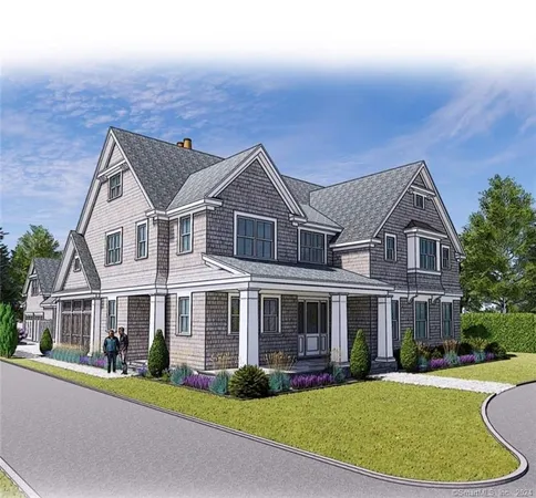 a front view of a house with a garden and yard