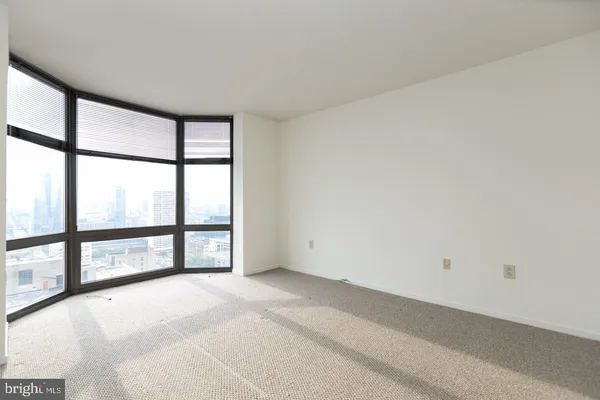 a view of an empty room with a large window