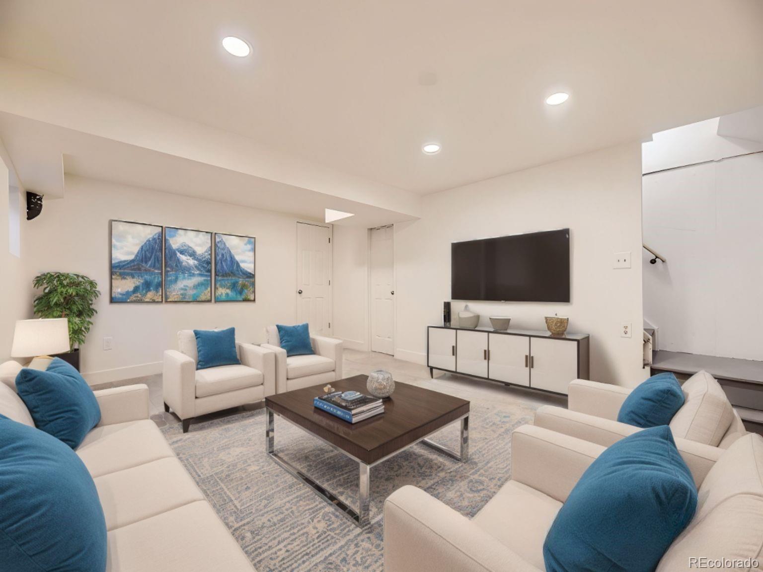 2949 Shady Hollow East Boulder, CO 80304 - Photo 11 of 31 a living room with furniture and a flat screen tv