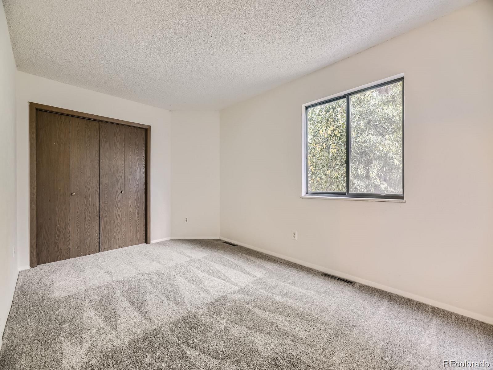 2949 Shady Hollow East Boulder, CO 80304 - Photo 19 of 31 a view of an empty room with a window