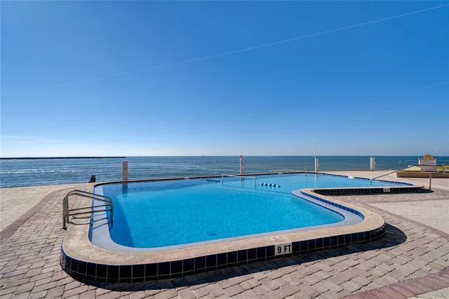 a view of a patio with couches and a table and chairs